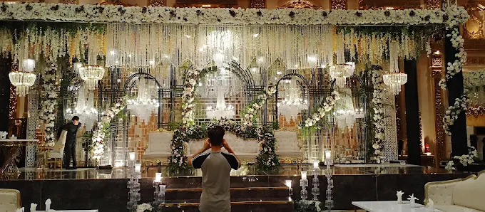 Buffet service under draped ceiling with chandeliers